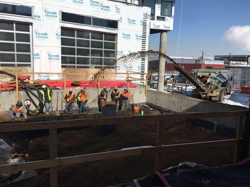 native fill, rain garden media, and topsoil placed for a rain garden outdoor patio area for a Denver hotel