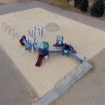 Bedrock Slingers playground renovation project to create an ADA accessible playground replacing sand with pea gravel and EWF for safe, easily accessible play for all students.