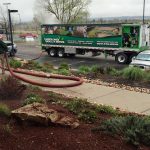 recycled, dyed mulch around a commercial property using blower trucks
