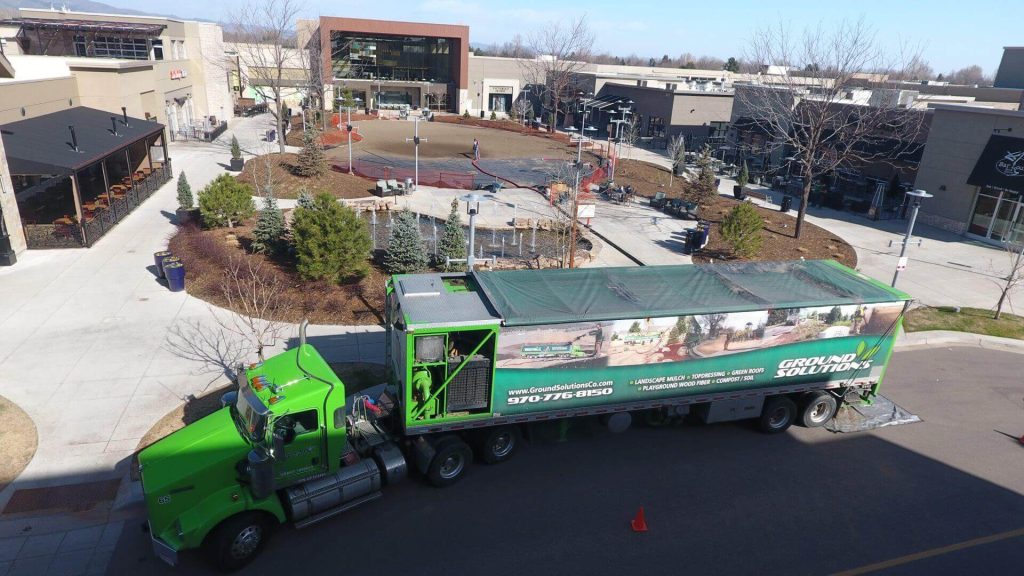 amended soil blown into the Winter ice rink at a mall to prepare for the Summer lawn by Ground Solutions