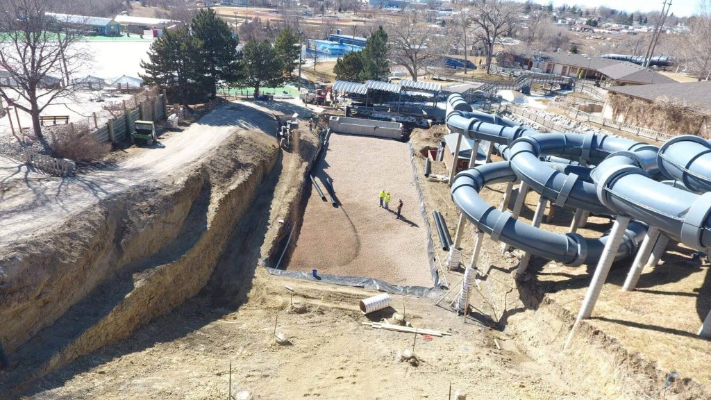 Slinger truck placed stone for a water park landing area in Hyland Hills