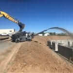 Excavation backfill with a rock slinger truck in Centennial